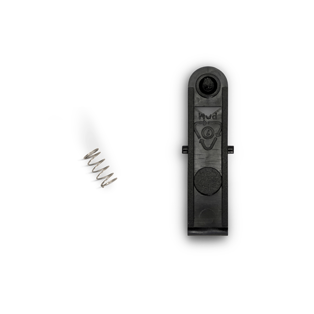 a small spring and a plastic arm are posed, showing the parts that make up the auto brew basket repair kit.