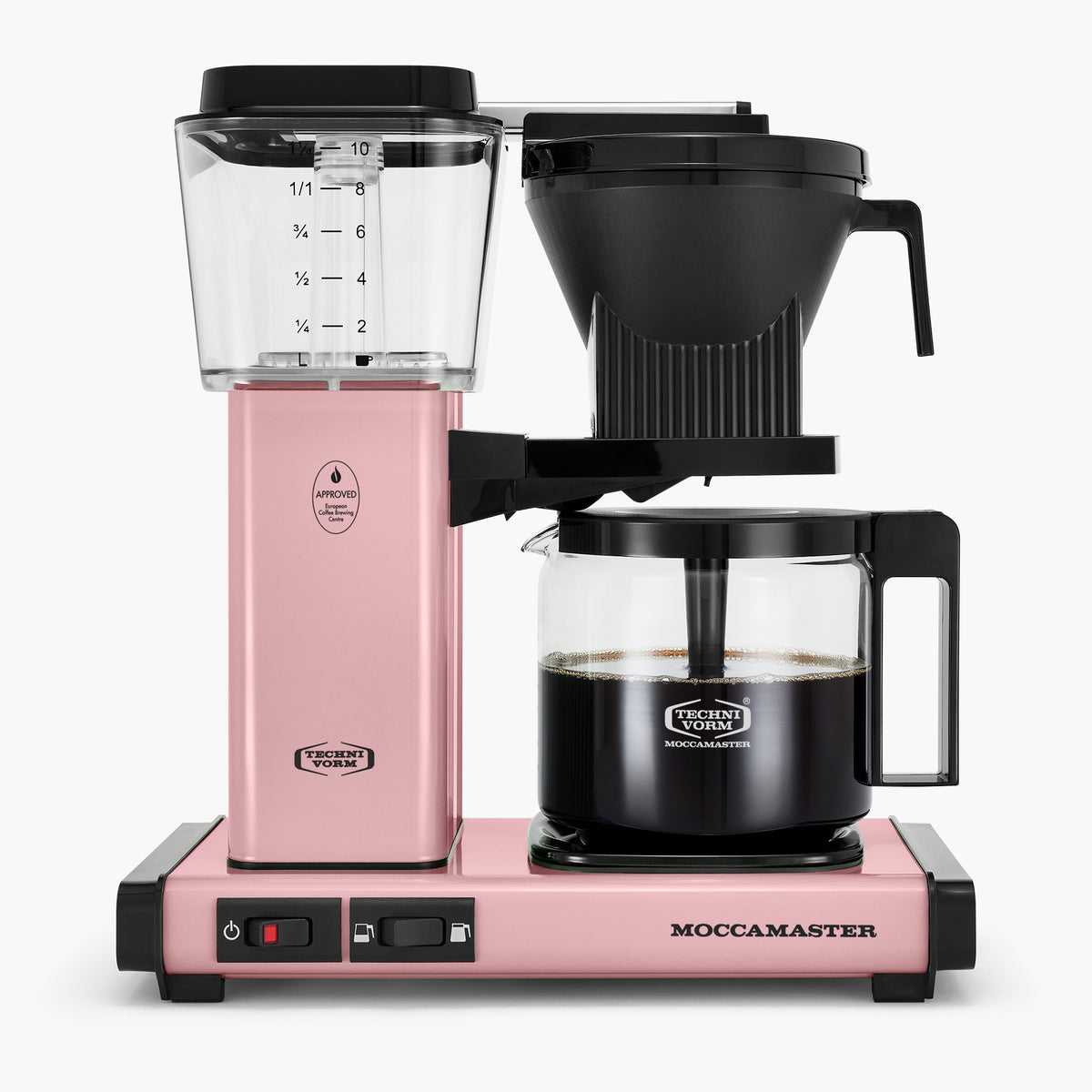 Pink Moccamaster coffee maker with a clear water reservoir, black brewing funnel, and glass carafe.