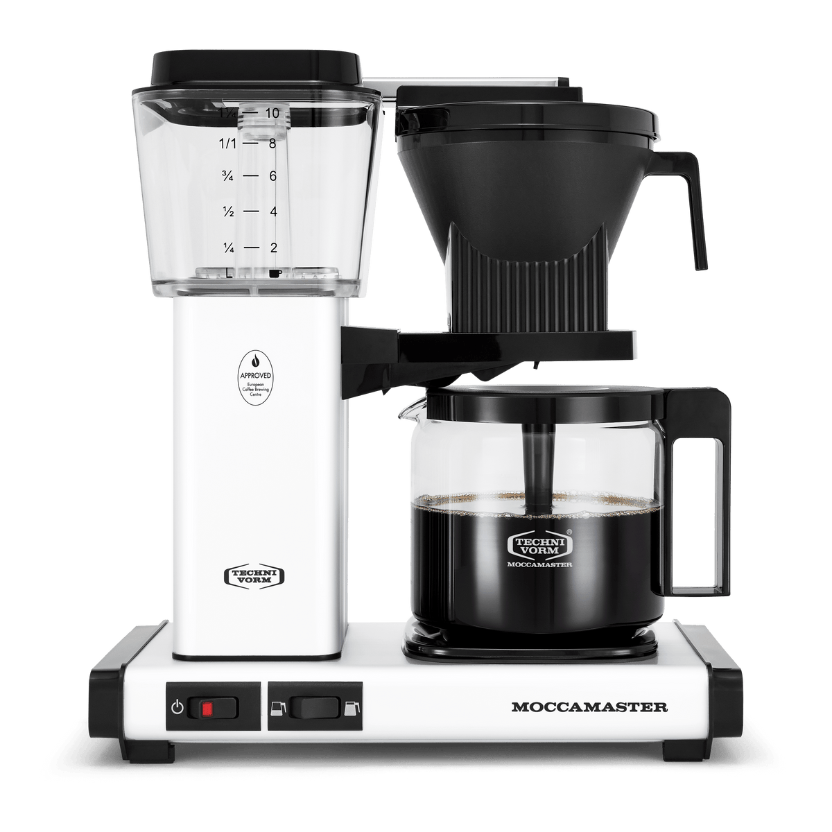 Front shot showing Moccamaster KBGV Select in Matte White, with rectangular tower and base, clear acrylic water reservoir with fill level marks, power and volume selector switch, glass carafe with black handle, and black automatic brew basket.