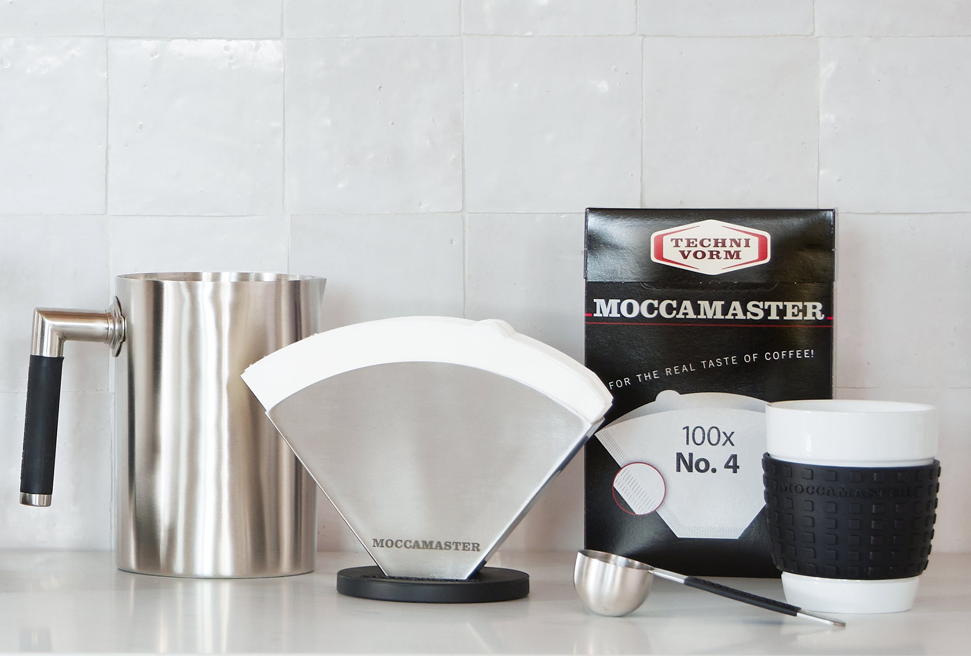 Image of Moccamaster accessories and filters on a kitchen counter.