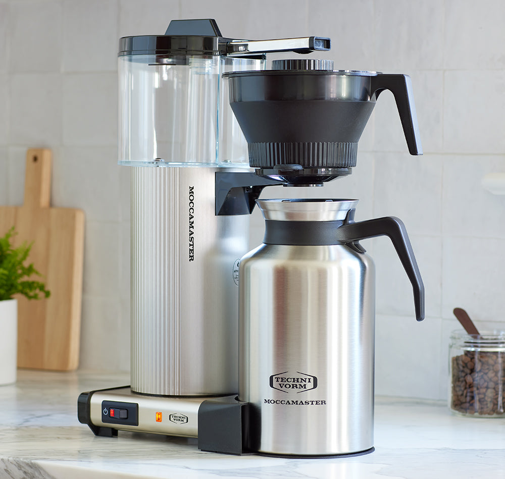 Brushed silver CDT Grand coffee brewer on a kitchen counter.