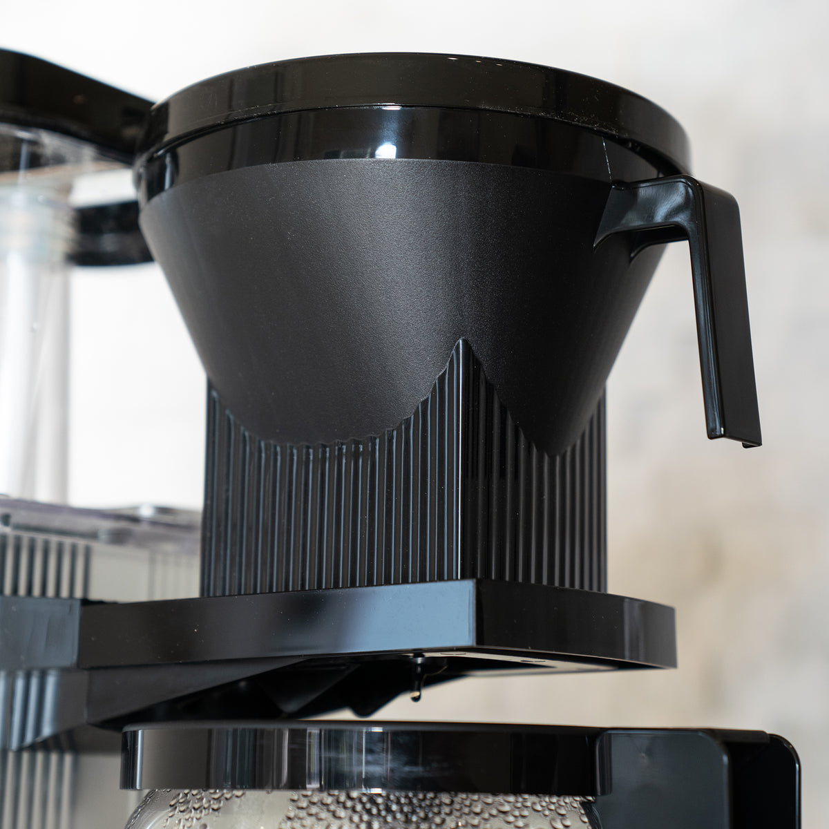 Close up of an Automatic Drip-Stop Brew Basket on a Moccamaster coffee brewer.