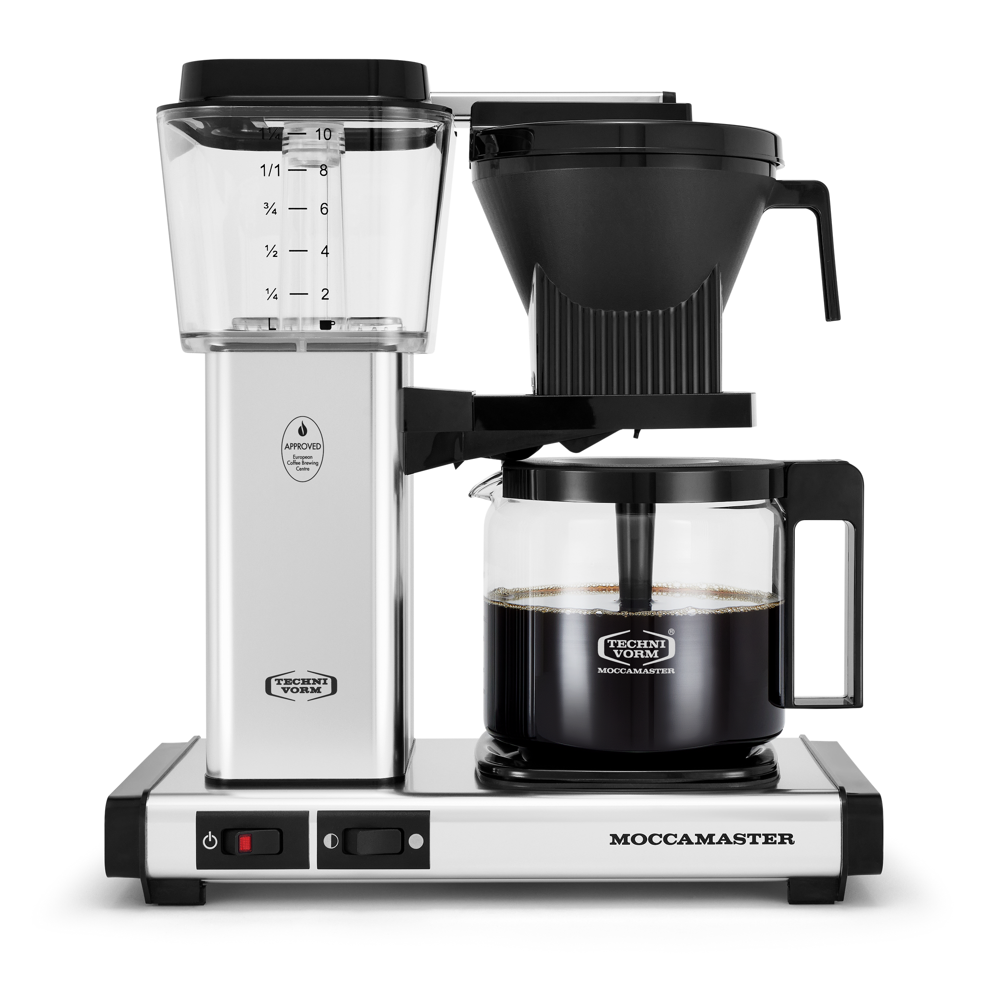 Front shot showing Moccamaster KBG in Polished Silver, with rectangular tower and base, clear acrylic water reservoir with fill level marks, power and hotplate level switches, glass carafe with plastic handle, and black automatic brew basket.  