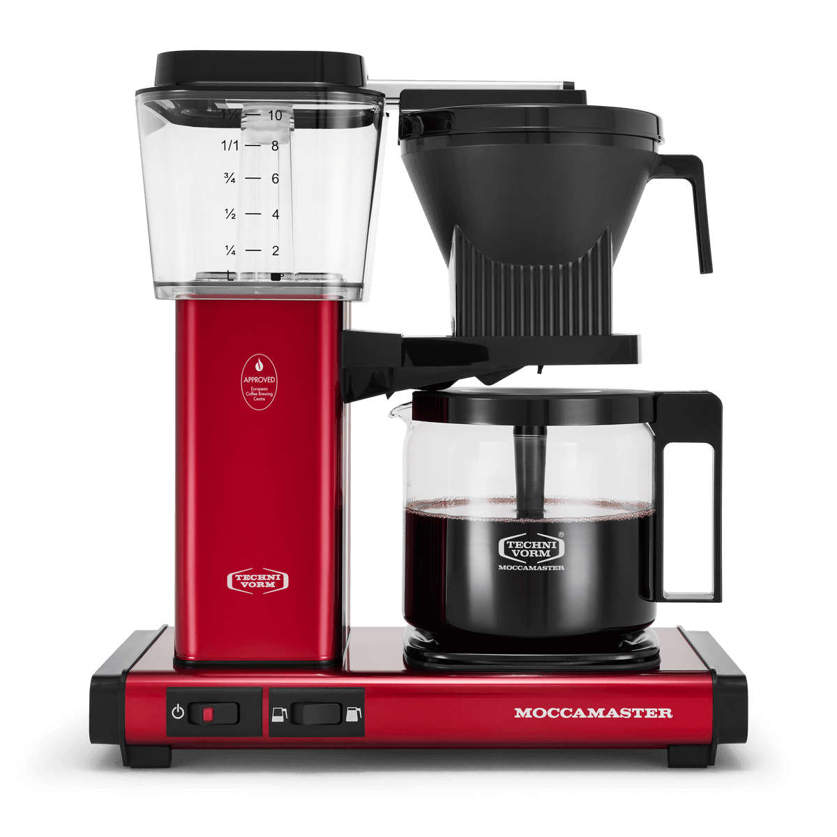 Front shot showing Moccamaster KBGV Select in Candy Apple Red, with rectangular tower and base, clear acrylic water reservoir with fill level marks, power and volume selector switch, glass carafe with black handle, and black automatic brew basket.